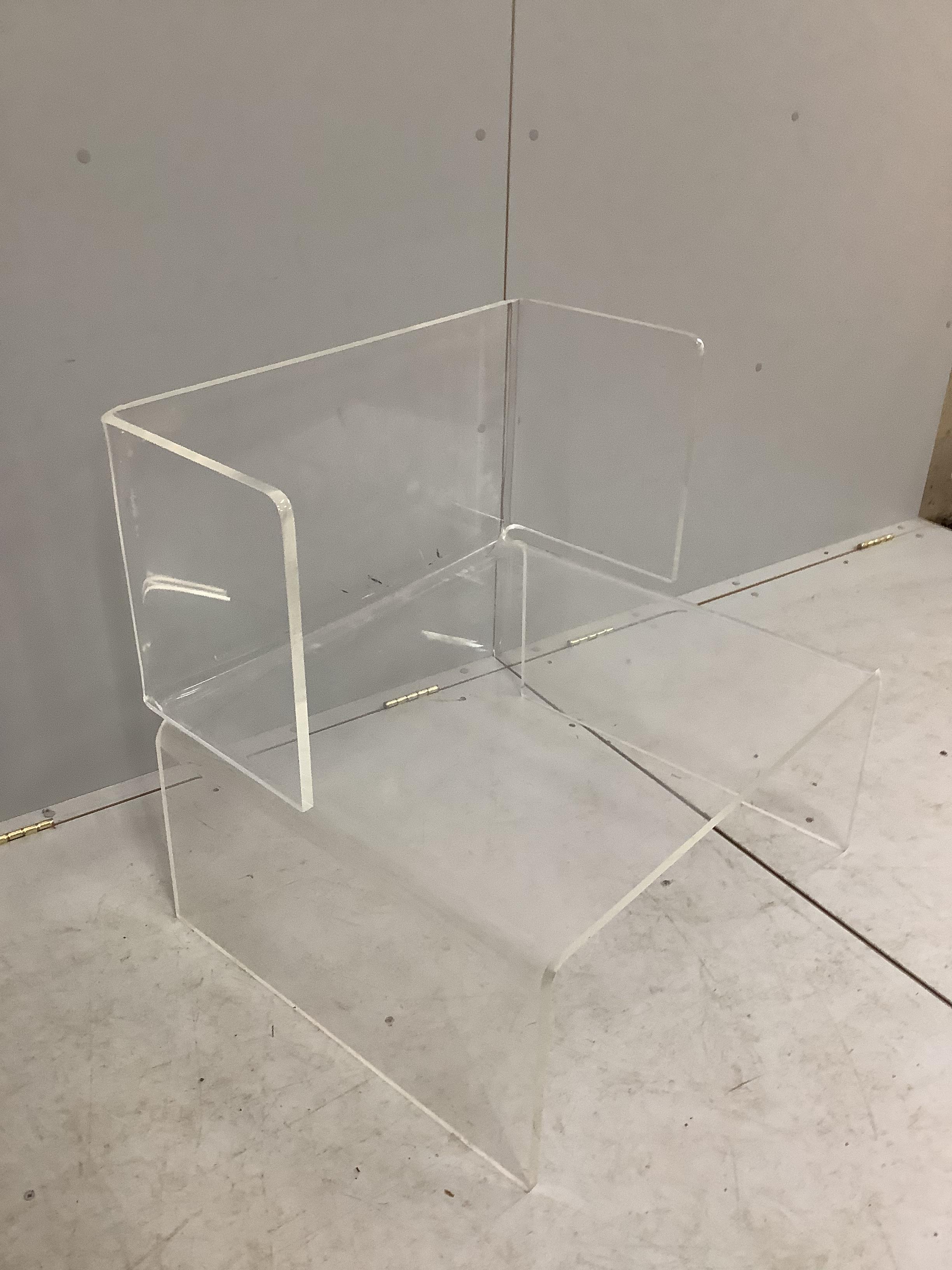 A contemporary mid century Lucite acrylic chair, width 73cm, depth 60cm, height 80cm